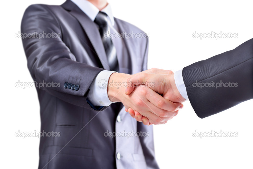 Photo of handshake of business partners after signing promising contract