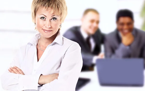 Successful business woman looking confident and smiling — Stock Photo, Image