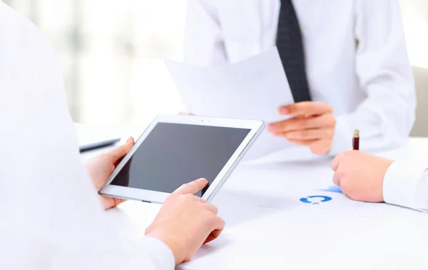 Close-up of a modern business team using tablet computer to work — Stock Photo, Image