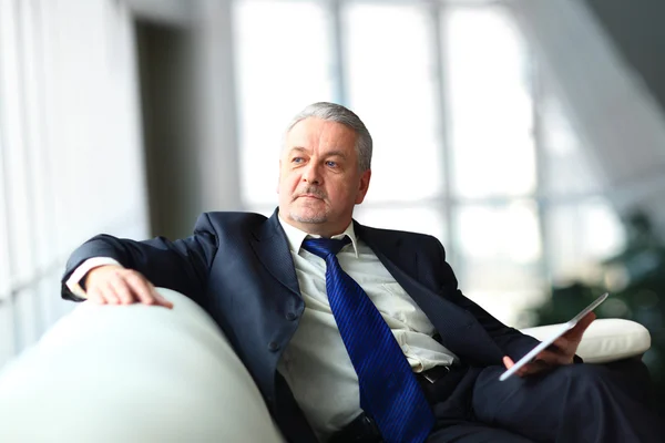 Portrait of a mature businessman with digital tablet — Stock Photo, Image
