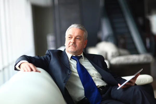 Portrait of a mature businessman with digital tablet — Stock Photo, Image