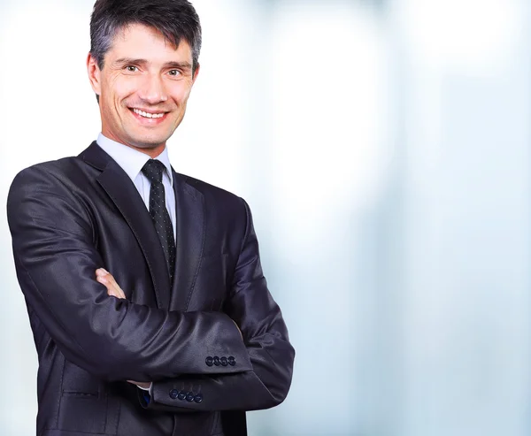 Portrait of a smiling handsome businessman — Stock Photo, Image