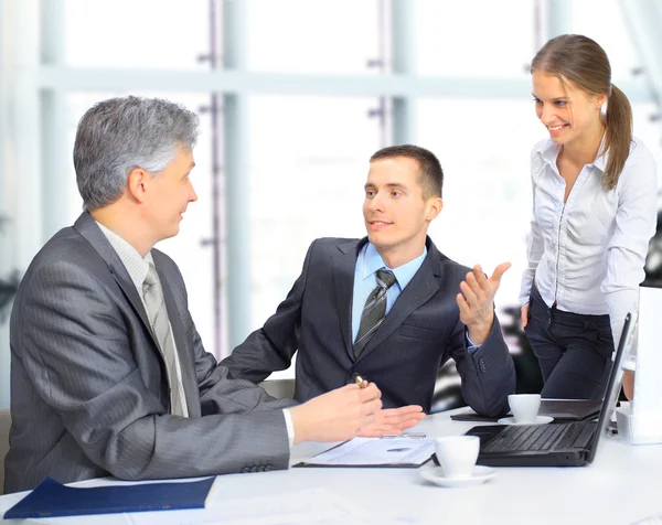 A business team sitting in office and planning work Stock Image