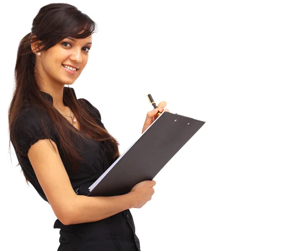 Charming girl holding a folder and looking at camera with a smile — Stock Photo, Image