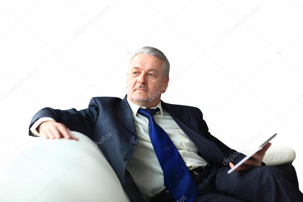 Portrait of a mature businessman with digital tablet
