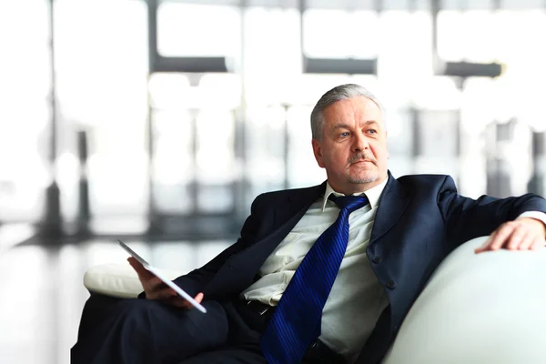 Portrait of a mature businessman with digital tablet — Stock Photo, Image