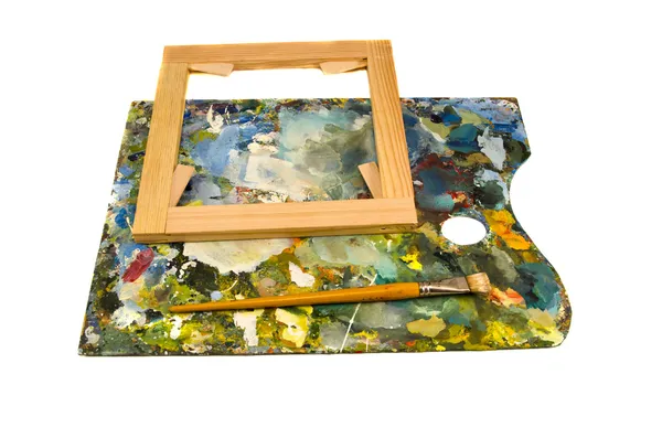Paleta de pintores com moldura de pincel e lona em branco — Fotografia de Stock