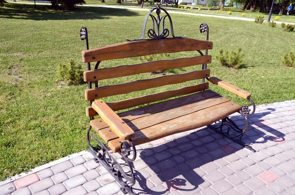 Original handmade bench in city park — Stock Photo, Image