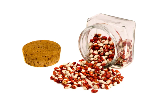 Colorful beans and glass jar on white — Stock Photo, Image