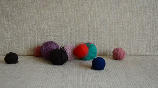 Thread balls on divan — Stock Video