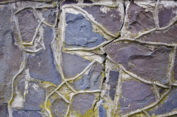 Cracked e vecchio sfondo muro di pietra — Foto Stock