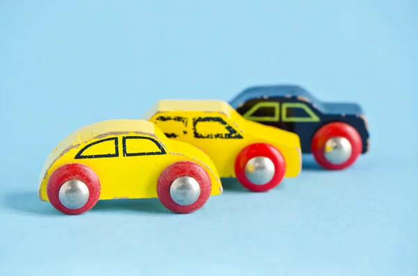 Three old wooden and colorful cars toys — Stock Photo, Image