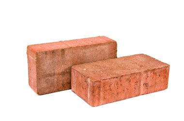 Two red decorative pavement bricks isolated on white