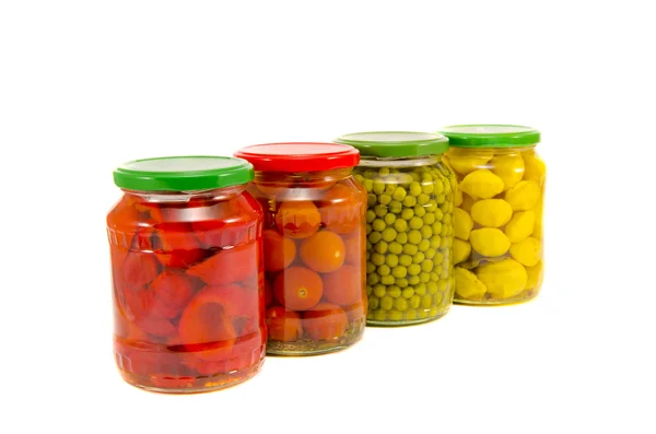 Four potted vegetables glas jars isolated on white — Stock Photo, Image
