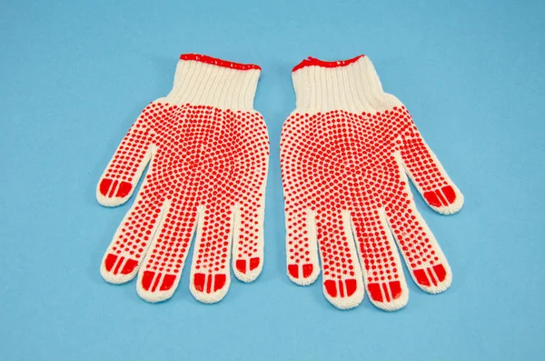 Защитные перчатки на лазурном фоне — стоковое фото