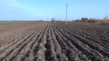 Plowed autumn time farm field