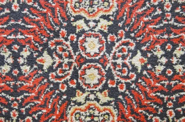 Viejo fragmento de alfombra fondo — Foto de Stock