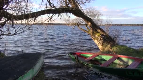 Autumn lake landscape and two boats — Stock Video