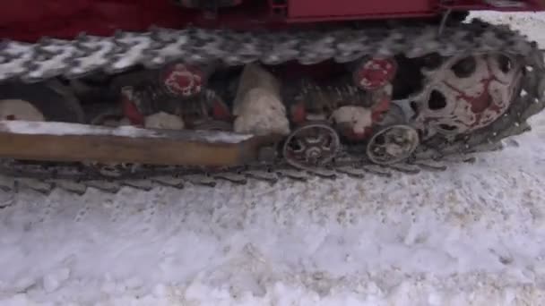 Caterpillar tractor working on winter snow — Stock Video