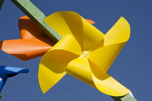 Yellow paper windmill toy — Stock Photo, Image