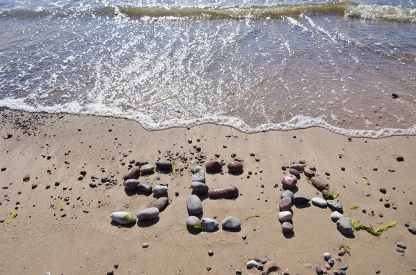 Wort Meer Konzept am Strand Sand und Wellen — Stockfoto