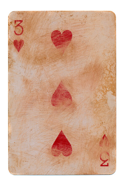 old grunge playing card with three red hearts isolated on white