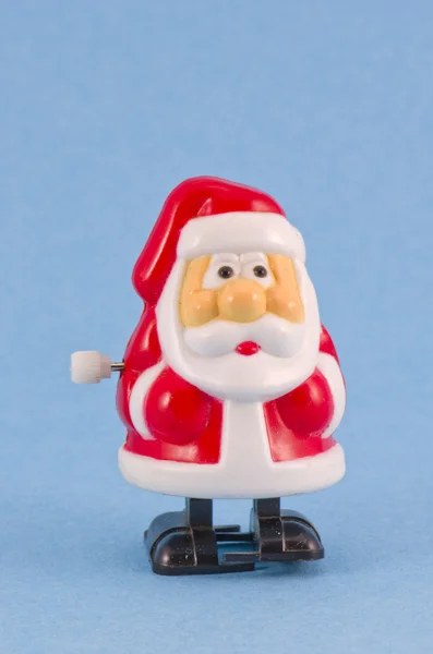 Kis műanyag óramű játék hóember, kék alapon — Stock Fotó