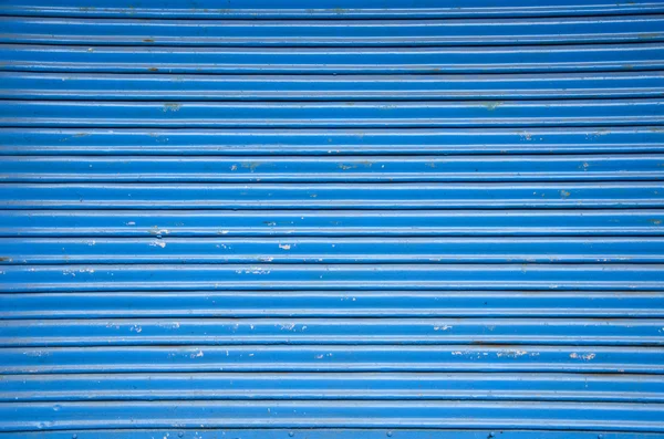 Azul metal tienda puerta fondo — Foto de Stock