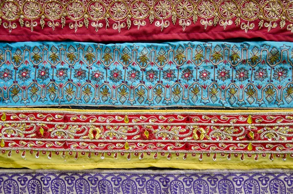 Indická ručně vyráběné dekorativní tkaniny pozadí — Stock fotografie