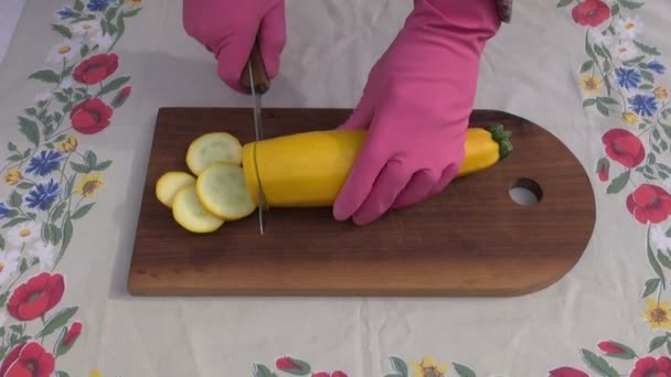 Cut fresh zucchini vegetable slice on wooden board — Stock Video