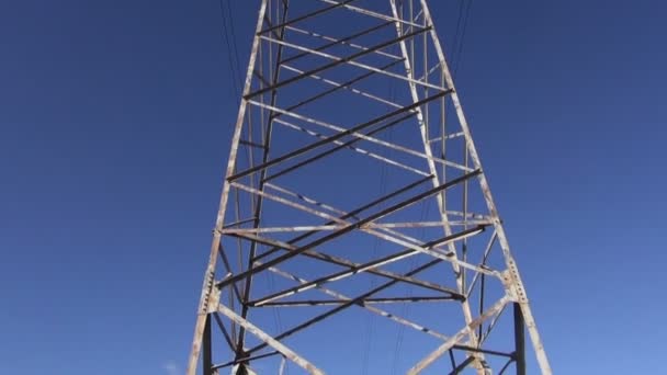 High-voltage electric tower construction and camera rotation — Stock Video