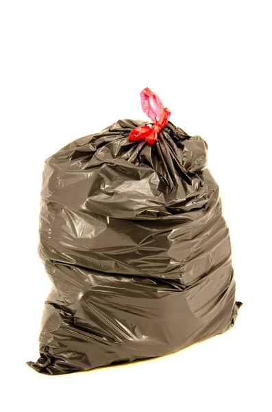 Isolated full black garbage bag in white background — Stock Photo, Image