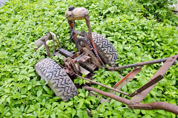 Old broken motor plough in farm spring garden — Stock Photo, Image