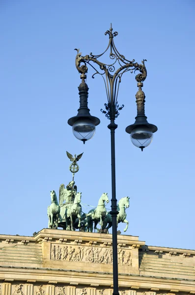 Brandenburg gate in Berlin and decorative lamp — Stock Photo, Image