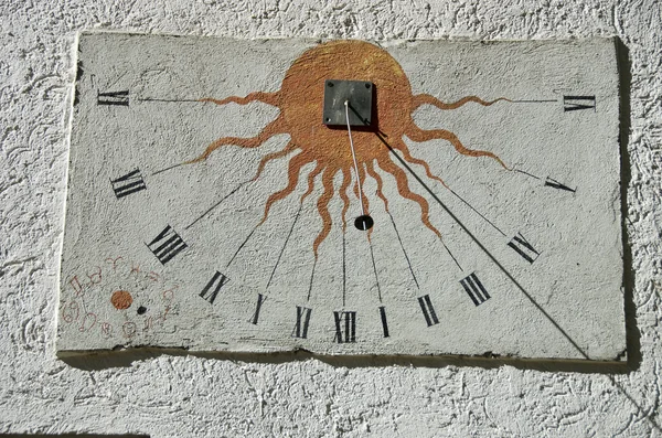 Ancient sundial with signs of the zodiac on white  wall — Stock Photo, Image