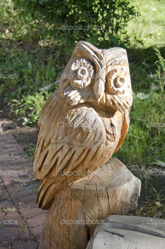 Carved wooden owls for garden Wooden carved owl in summer garden