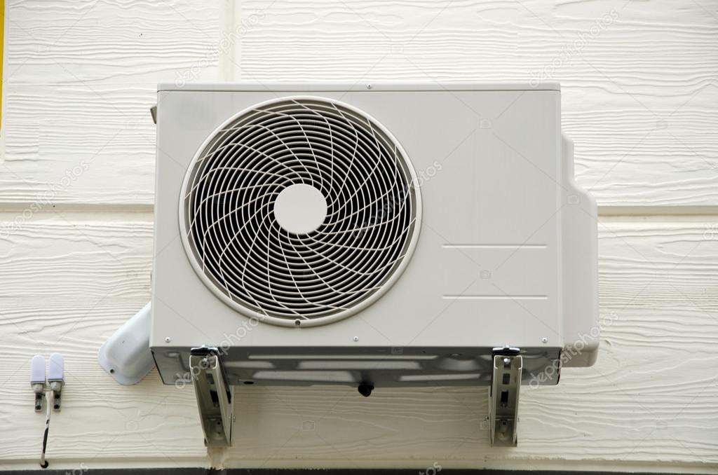 Air compressor fan on  wall 