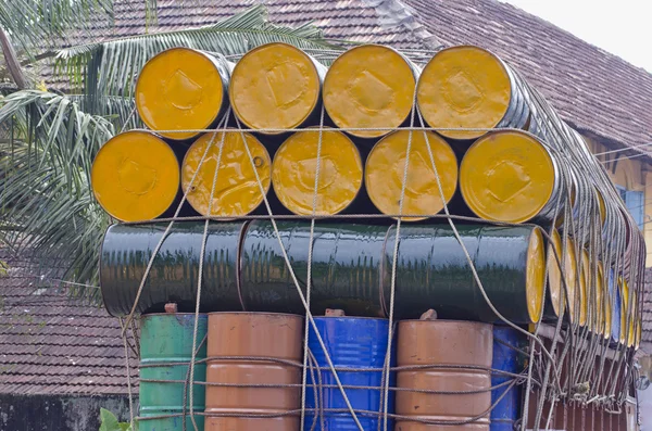 Metal barrels stacked atop truck, south india — Stock Photo, Image