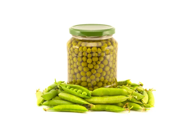 Green peas vegetables canned preserved in glass jars pots isolated on white — Stock Photo, Image