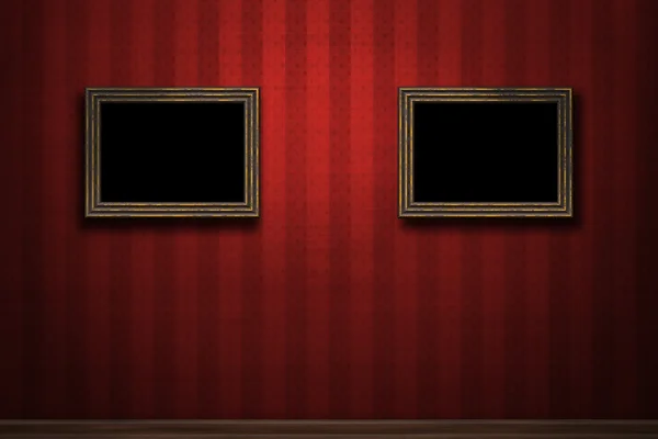 Old wooden frames on red retro grunge wall — Zdjęcie stockowe