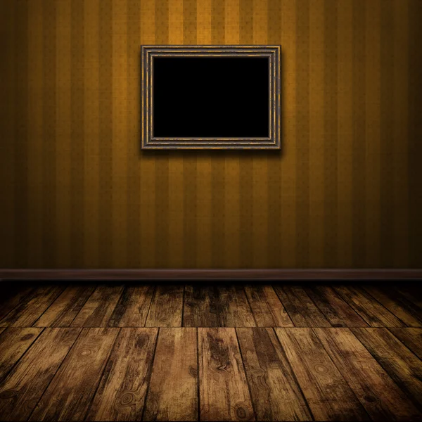 Ciemny wzór pokój z drewnianą podłogą i stary ramki na ścianie — Zdjęcie stockowe