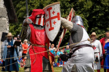 CHORZOW,POLAND, JUNE 9: Fight of medieval knights during a IV Co clipart