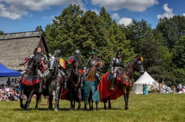 CHORZOW,POLAND, JUNE 9: 5 medieval knights on horsebacks during clipart