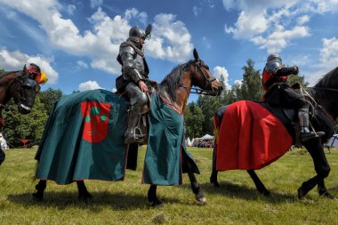 CHORZOW,POLAND, JUNE 9: Medieval knight on horseback during a IV clipart