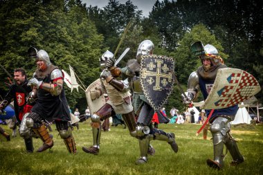 CHORZOW,POLAND, JUNE 9: Charge of the medieval knights during a clipart