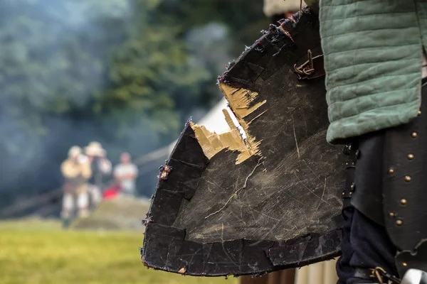 Damaged shield of medieval knight — Stock Photo, Image