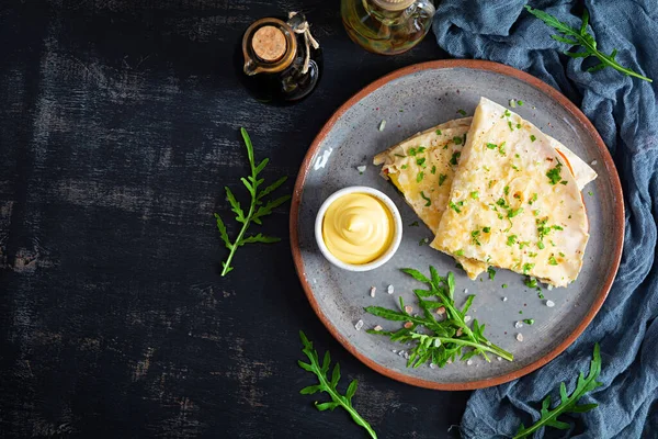 Fried pita bread with scrambled eggs, tomatoes, meat and cheese. Stuffed lavash