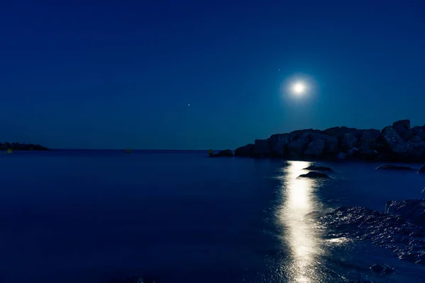 Mediterranean Sea Beach at Night with Full Moon Royalty Free Stock Images