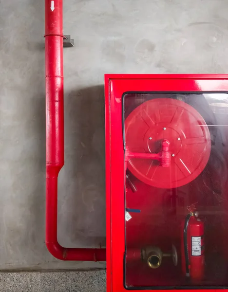 Red Emergency Cabinet Fire Hose Reel Fire Extinguisher Concrete Wall Stock Picture