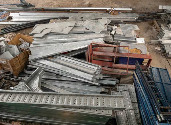 Group of the metal frame and equipment pile on the ground for use to build the construction frame of the monorail station in the urban area.